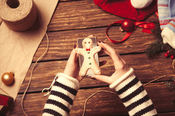 Woman wrapping a christmas cookie