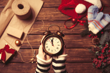 Woman holding alarm clock