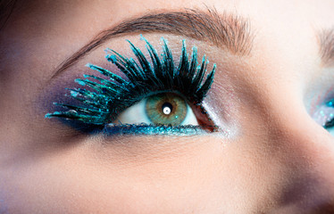 Wintry Creative Eye Makeup. False Long Blue Eyelashes Closeup 
