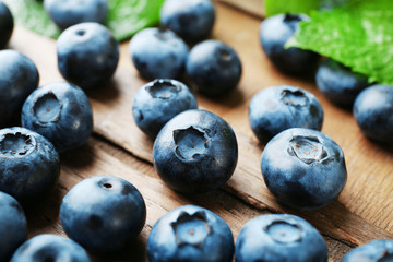Fresh blueberries on wooden table, closeup