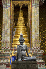 Vertical image of a Hermit statue in Bangkok at the entrance to the Grand Palace