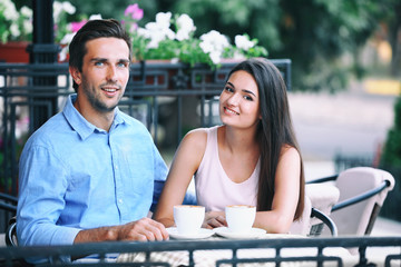 Young couple in street cafe