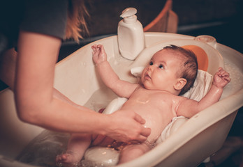 Small baby first bathing © poplasen