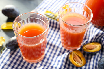 Plum Juice in a glasses with fresh fruits