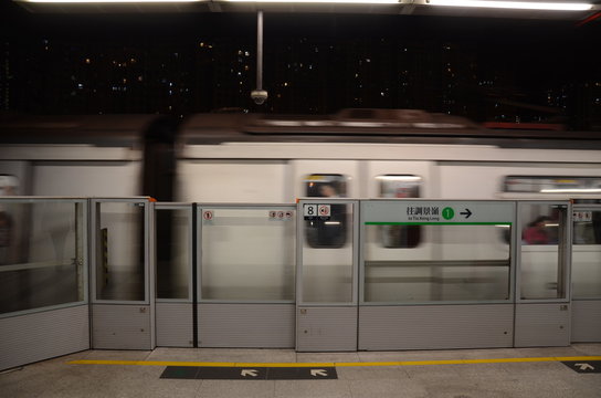 Moving Train on Hong Kong MTR Platform