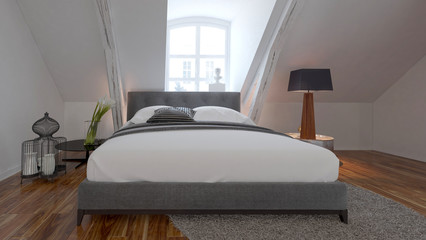 Bedroom interior with bed under a roof slope