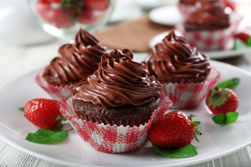 Chocolate cupcakes on plate closeup