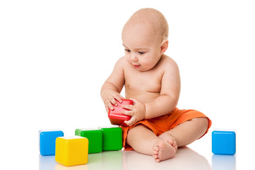 Funny little boy with blocks, isolated on white