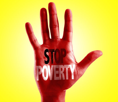 Stop Poverty written on hand with yellow background
