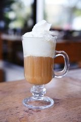 Iced coffee on table in cafe, close-up