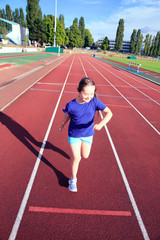 Fototapeta premium Little girl have fun on the stadium