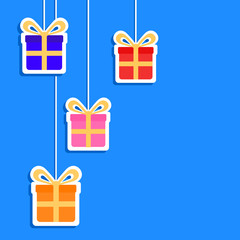 Colorful gifts on blue background with copy space.