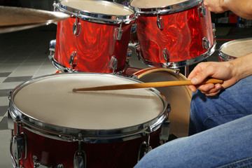 Obraz na płótnie Canvas Musician playing the drums closeup