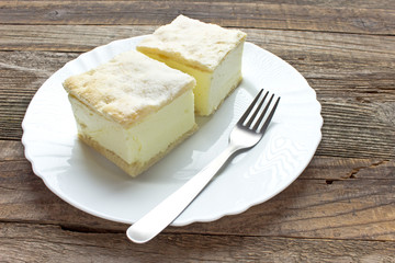 Cream pie with layers of puff pastry in plate