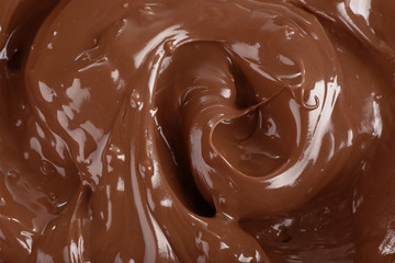 Background of melted milk chocolate, close-up
