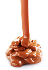 Milky brown chocolate pouring, isolated on white