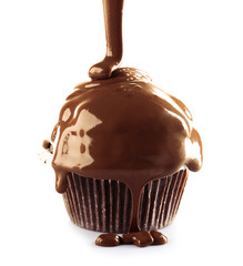 Delicious cupcake with melted chocolate topping, isolated on white