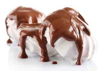 Chocolate poured on marshmallow isolated on white