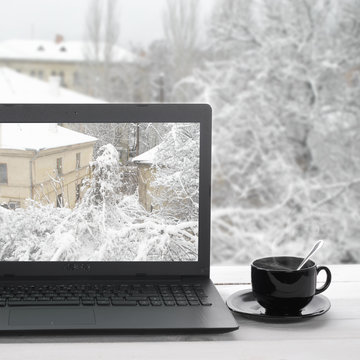 Laptop on winter window