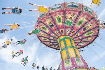 Foto auf Acrylglas Colorful, traditional fairground ride on a sunny day © Alison Toon