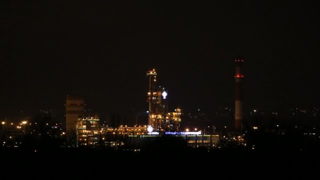 The lights of the refinery at night, isomerization unit
