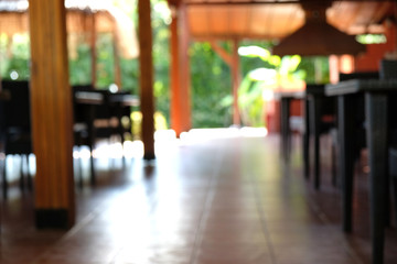 Blur empty seat and table in  dining room of hotel