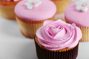 Tasty cupcakes on stand, close-up