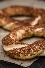 Simit, Nicely Baked Traditional Turkish Bagel with Sesame on Dark Wooden Background