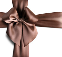 Brown ribbon with bow isolated on white