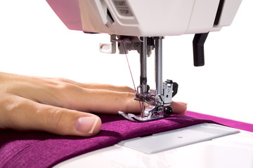 Sewing Process - woman sews fabric