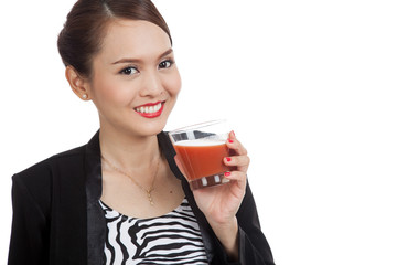 Young Asian business woman drink tomato juice