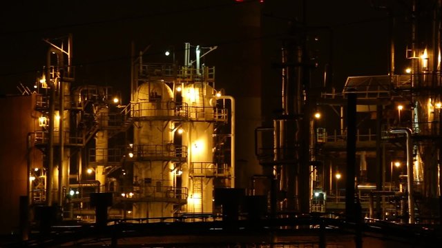 The lights of the refinery at night, columns of isomerization unit
