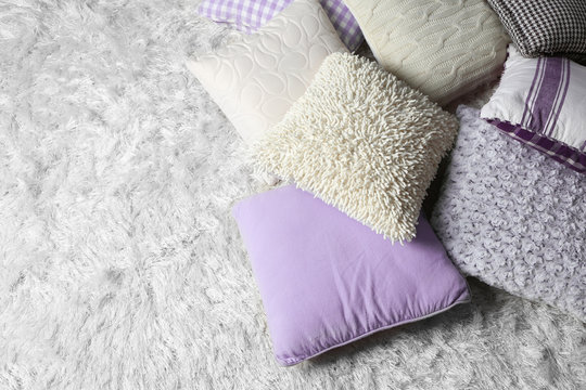 Few pillows on light carpet