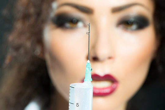 Nurse holding suringe