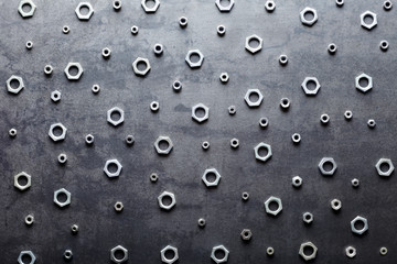 Abstract metal screw nuts background