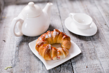 Cup of tea with croissant