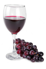 red wine glass with red grapes isolated on white