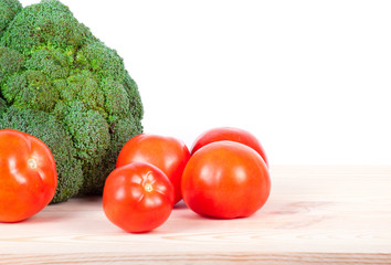 broccoli and tomatoes on wood