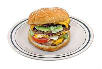 Triple Cheeseburger on White Plate isolated