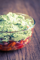 Bowl of guacamole with salsa