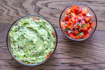 Bowls of guacamole and salsa