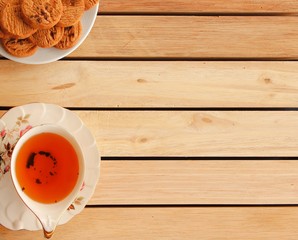 Chocolate Cookies and tea put on Wooden