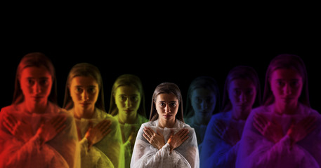 young girl meditating with aura colors