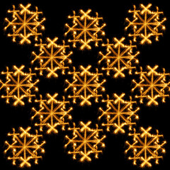 Background of snowflakes made sparklers on black