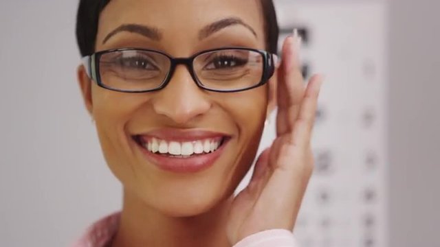 Happy black woman wearing eyeglasses