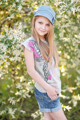 portrait of little girl outdoors in summer