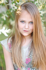 Fototapeta premium portrait of little girl outdoors in summer