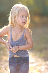 portrait of little girl outdoors in summer