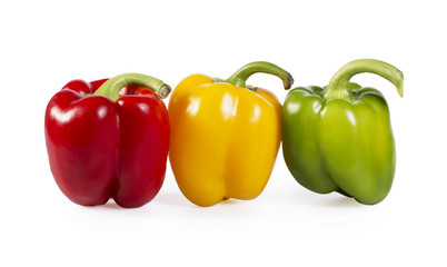 Red, green and yellow paprika on white