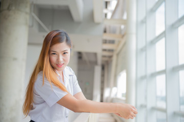 Fototapeta premium young attractive asian girl in a uniform of university ,Cute sc
